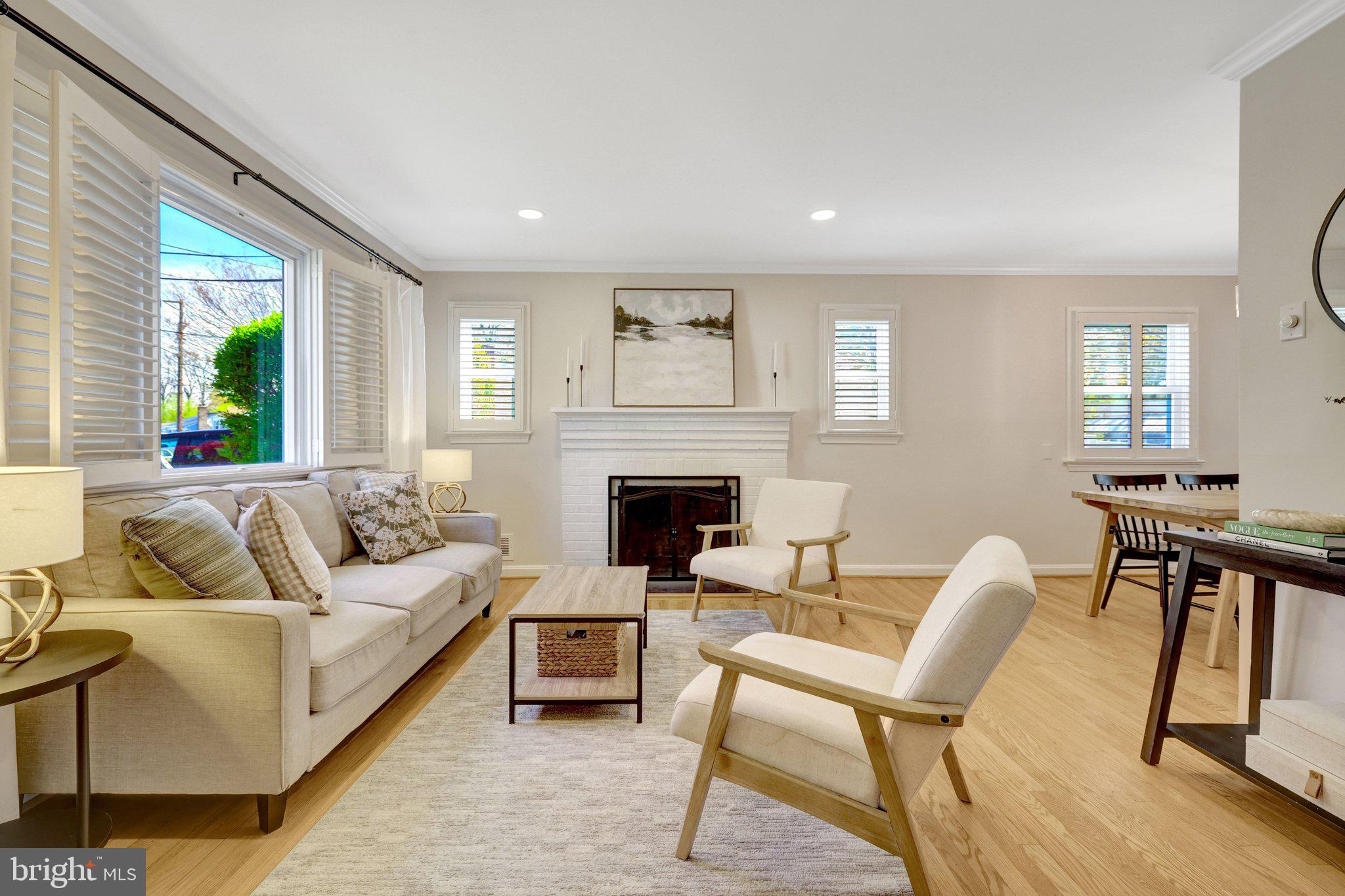 4132 Addison Road Fairfax, VA 22030 - Photo 9 of 58 a living room with furniture and a fireplace