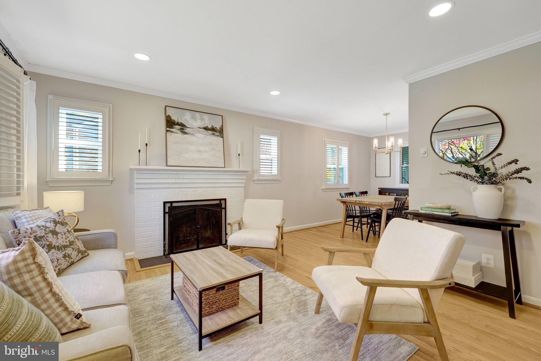 4132 Addison Road Fairfax, VA 22030 - Photo 10 of 58 a living room with furniture a fireplace with wooden floor