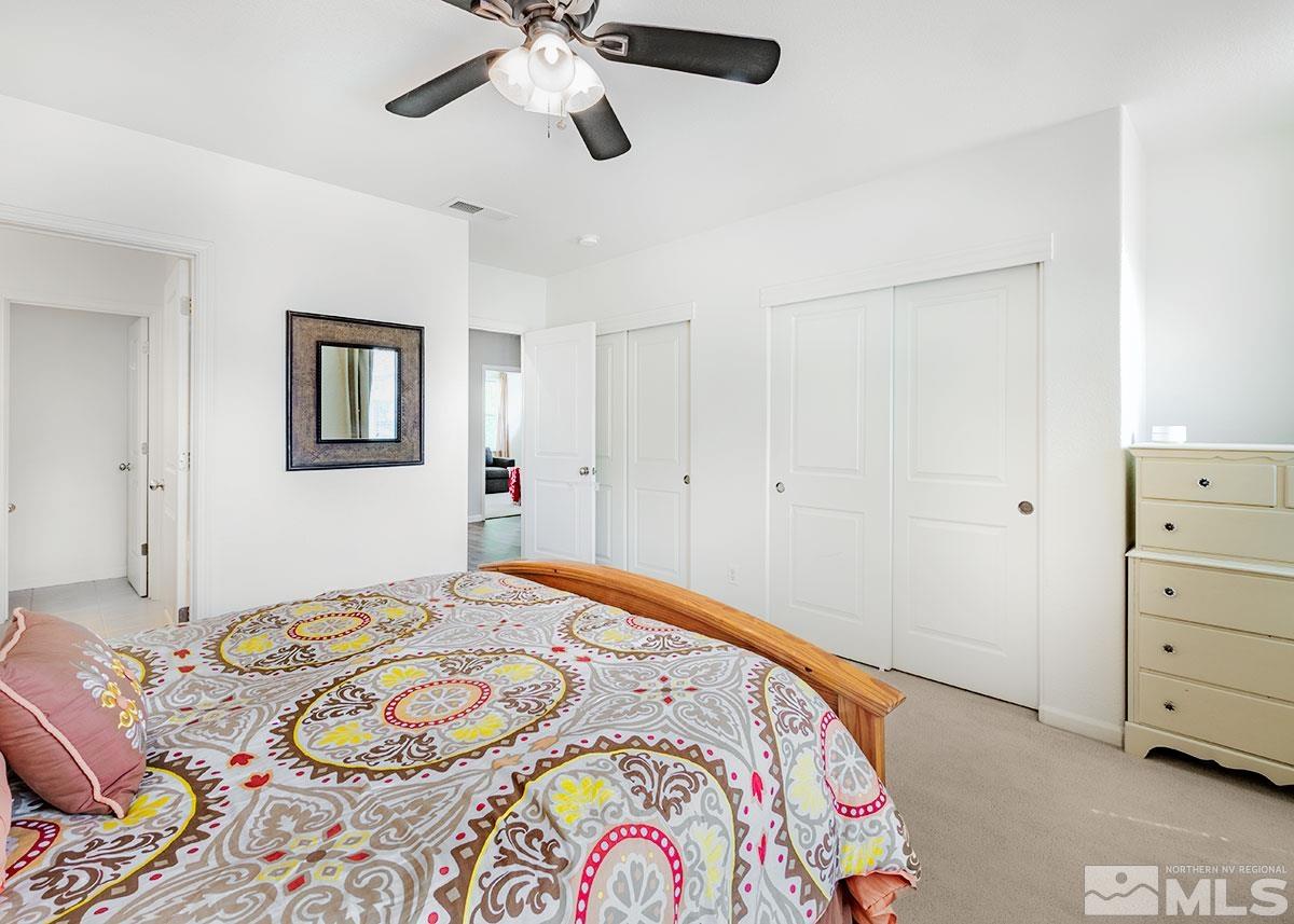 1633 Clover Hill Trail Reno, NV 89523 - Photo 17 of 37 a bedroom with a bed and a dresser