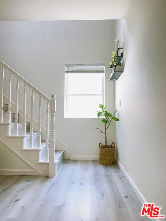 7864 Stewart And Gray Road Downey, CA 90241 - Photo 14 of 25 a white room with a potted plant