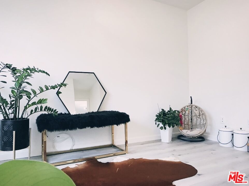 7864 Stewart And Gray Road Downey, CA 90241 - Photo 19 of 25 a living room with furniture and a potted plant