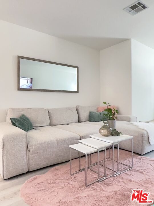 7864 Stewart And Gray Road Downey, CA 90241 - Photo 2 of 25 a living room with furniture and wooden floor