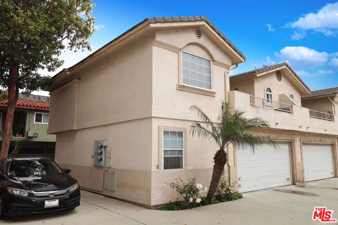 7864 Stewart And Gray Road Downey, CA 90241 - Photo 25 of 25 a front view of a house with a garden