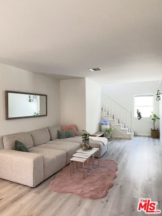7864 Stewart And Gray Road Downey, CA 90241 - Photo 4 of 25 a living room with furniture and a couch