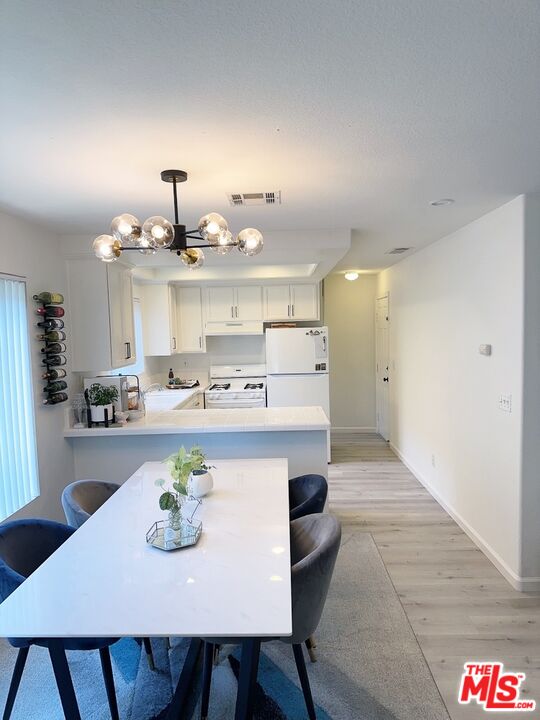 7864 Stewart And Gray Road Downey, CA 90241 - Photo 9 of 25 a view of kitchen with breakfast area