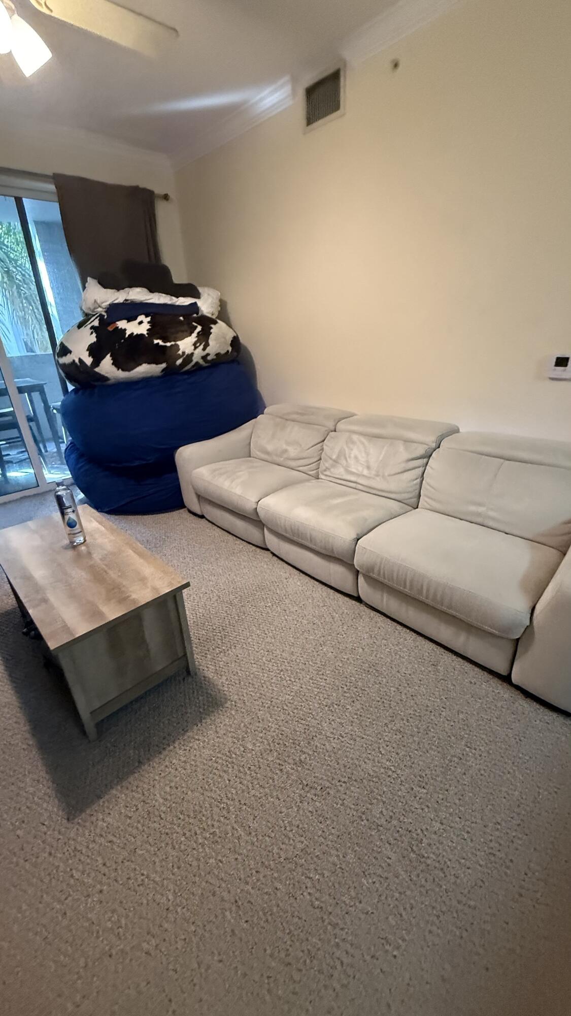 1690 Renaissance Commons Boulevard, Unit 1427 Boynton Beach, FL 33426 - Photo 11 of 20 a living room with furniture and a couch