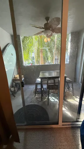 a view of living room with furniture and a large window