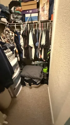 a room with water heater and wooden floor