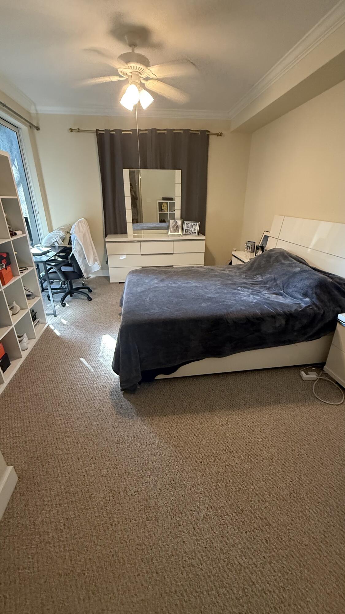 1690 Renaissance Commons Boulevard, Unit 1427 Boynton Beach, FL 33426 - Photo 15 of 20 a bedroom with a bed gym equipment and view of living room