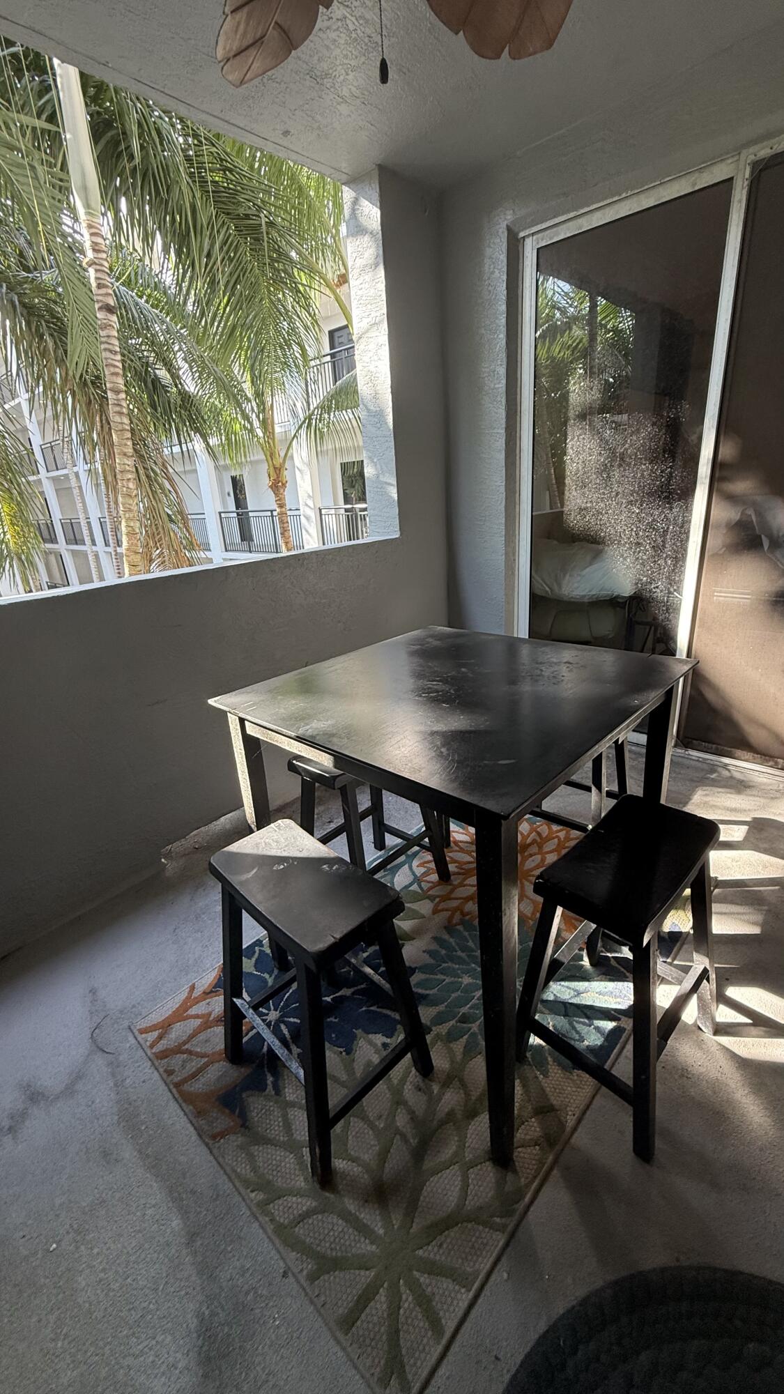 1690 Renaissance Commons Boulevard, Unit 1427 Boynton Beach, FL 33426 - Photo 2 of 20 a view of a workspace with furniture and window