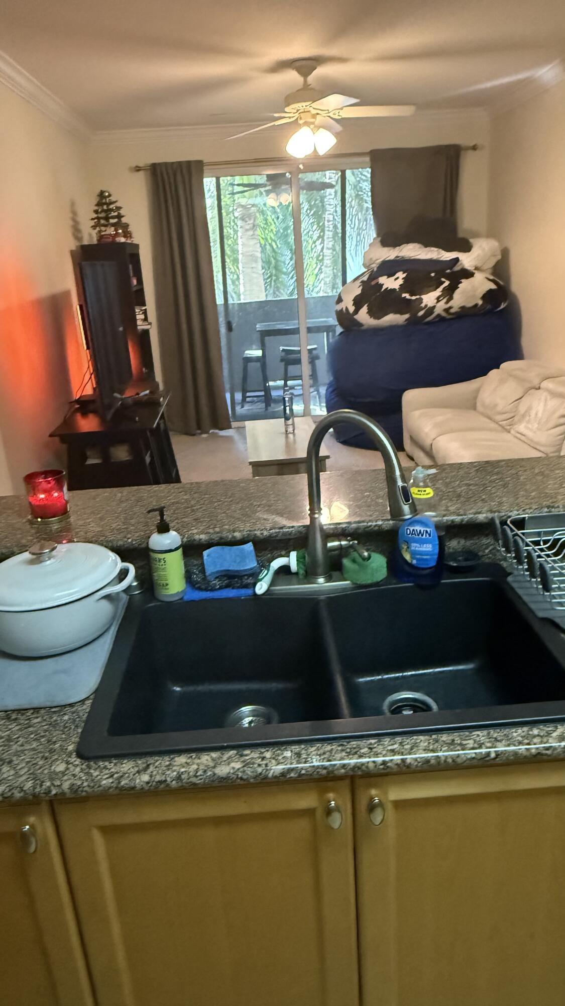 1690 Renaissance Commons Boulevard, Unit 1427 Boynton Beach, FL 33426 - Photo 9 of 20 a room with furniture and window