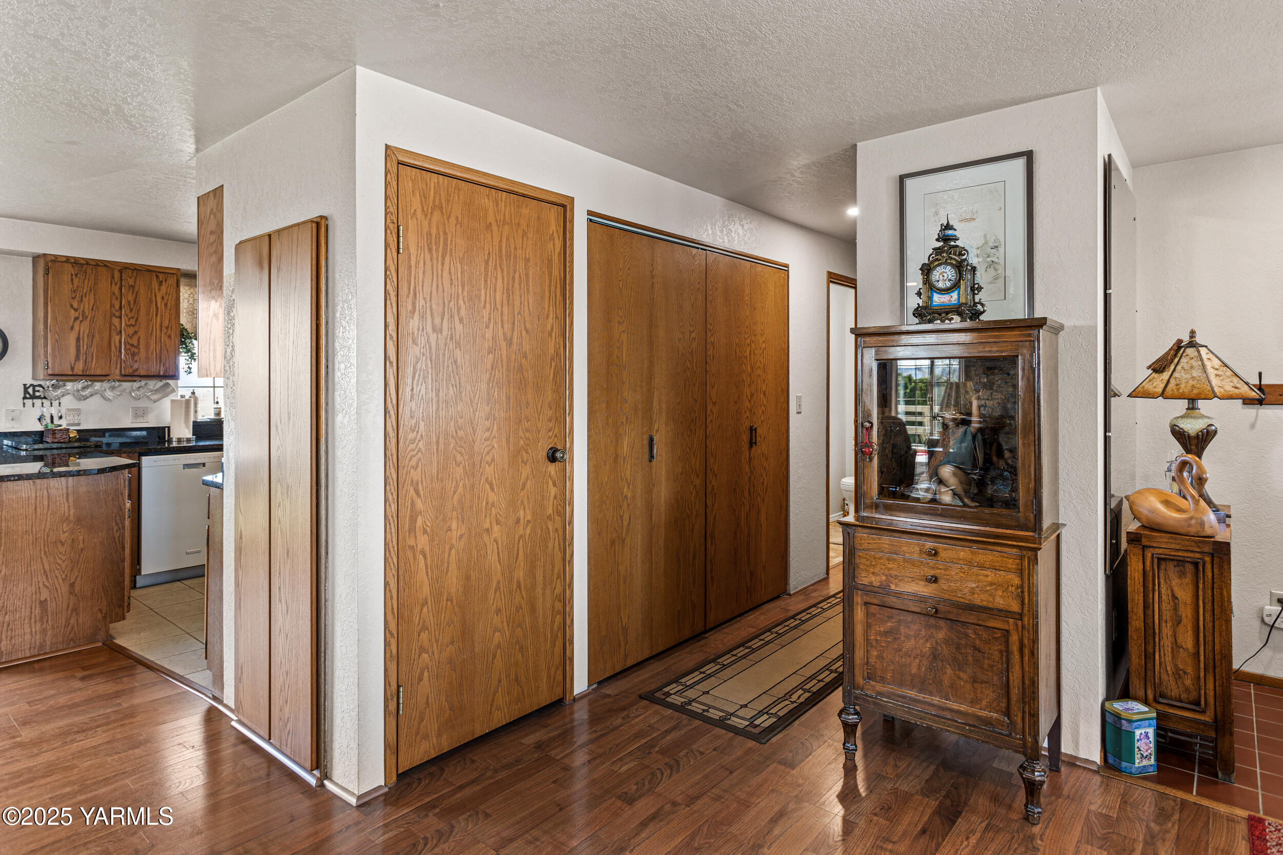 1682 St Hilaire Road Yakima, WA 98901 - Photo 18 of 51 a view of a hallway with wooden floor fireplace and living room