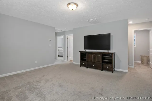 a room with furniture and flat screen tv