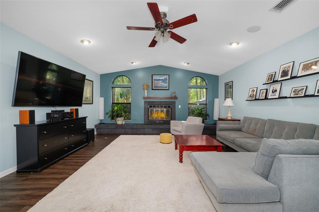 9923 Southwest 2nd Place Gainesville, FL 32607 - Photo 13 of 73 a living room with furniture and a flat screen tv