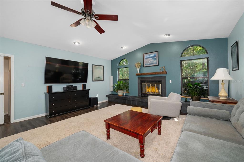 9923 Southwest 2nd Place Gainesville, FL 32607 - Photo 14 of 73 a living room with furniture and a flat screen tv