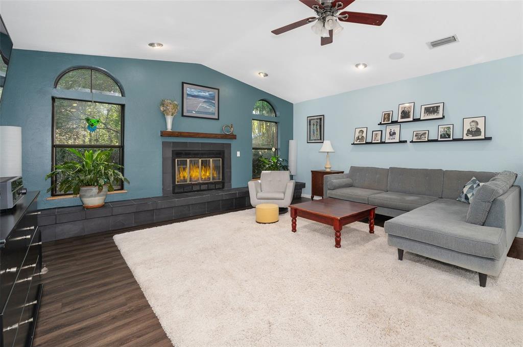 9923 Southwest 2nd Place Gainesville, FL 32607 - Photo 15 of 73 a living room with furniture and a fireplace
