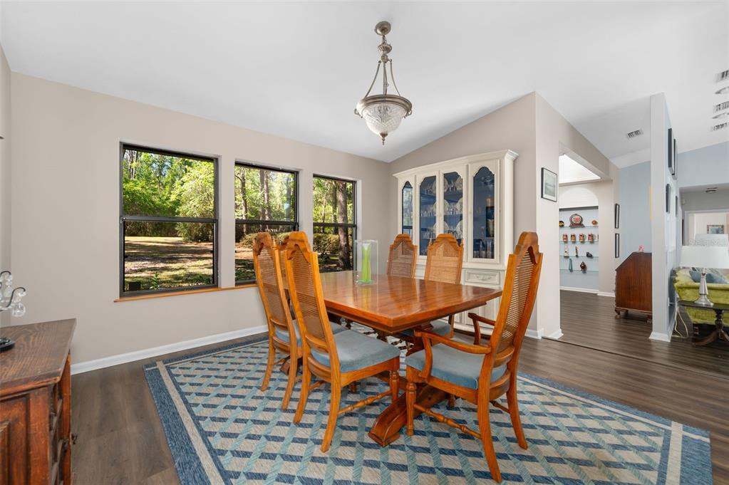 9923 Southwest 2nd Place Gainesville, FL 32607 - Photo 21 of 73 a view of a dining room with furniture window and wooden floor