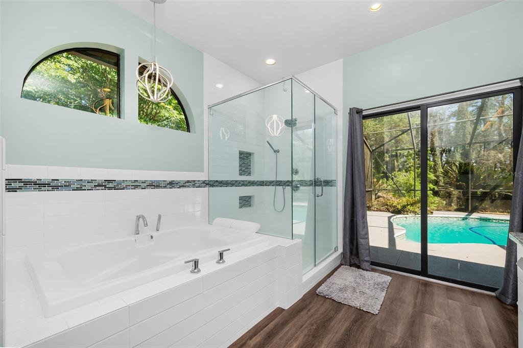 9923 Southwest 2nd Place Gainesville, FL 32607 - Photo 28 of 73 a bathroom with a bathtub and a window