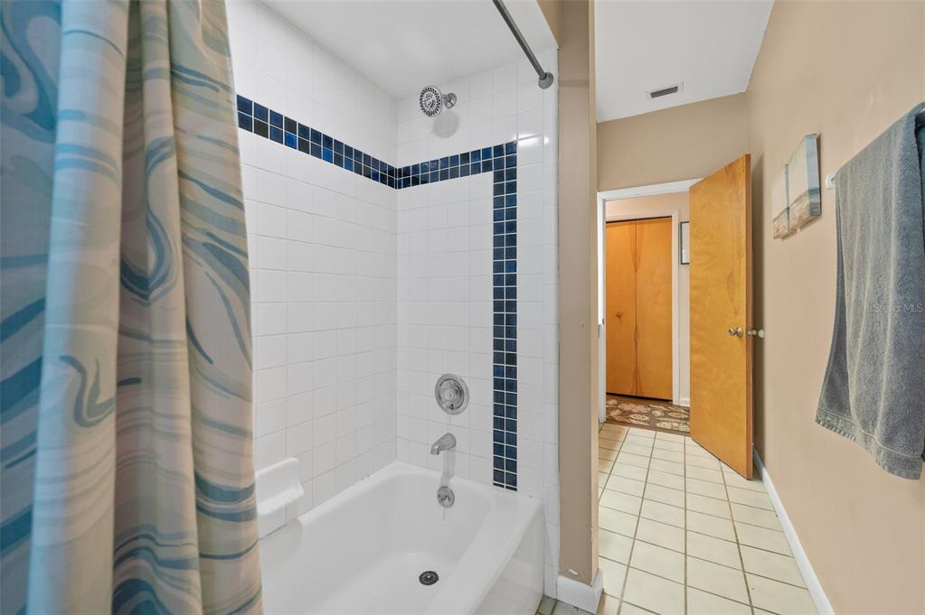 9923 Southwest 2nd Place Gainesville, FL 32607 - Photo 43 of 73 a bathroom with a bathtub and a shower