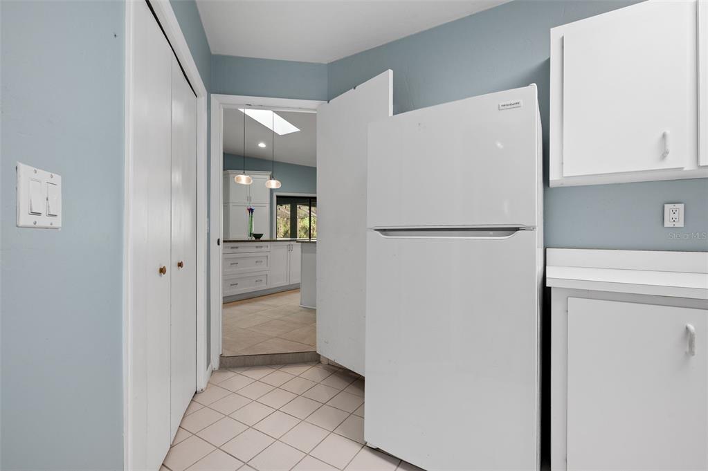 9923 Southwest 2nd Place Gainesville, FL 32607 - Photo 47 of 73 a view of a kitchen with a refrigerator and a stove