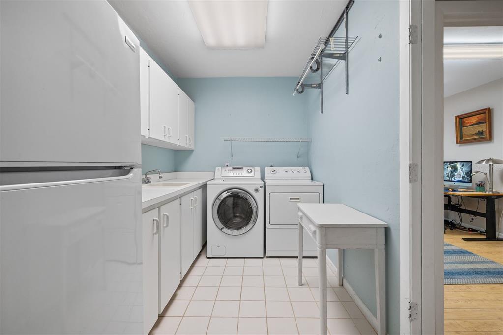 9923 Southwest 2nd Place Gainesville, FL 32607 - Photo 48 of 73 a utility room with dryer and washer