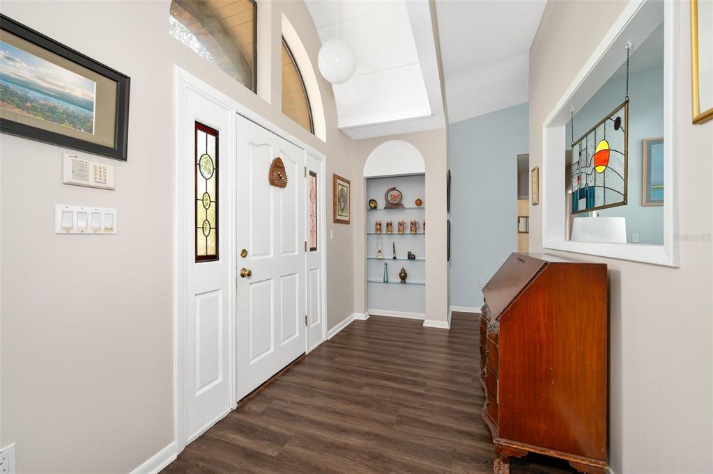 9923 Southwest 2nd Place Gainesville, FL 32607 - Photo 6 of 73 a view of a hallway with wooden floor and entryway
