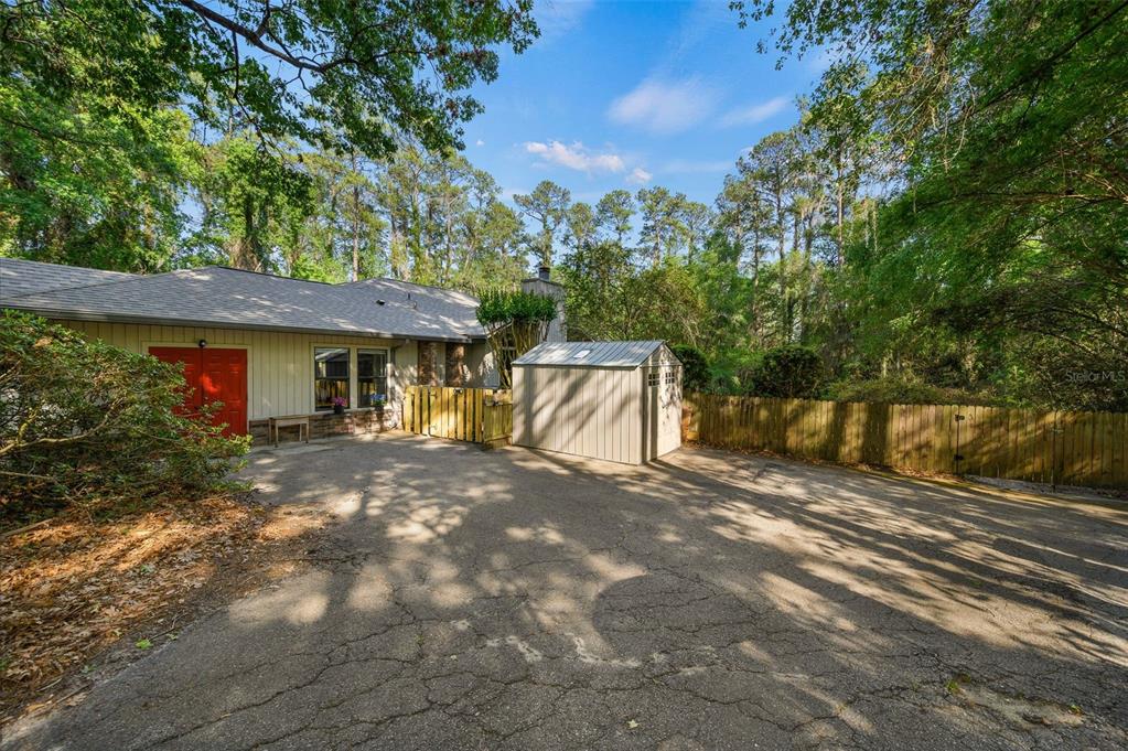 9923 Southwest 2nd Place Gainesville, FL 32607 - Photo 67 of 73 a view of a house with backyard and garden