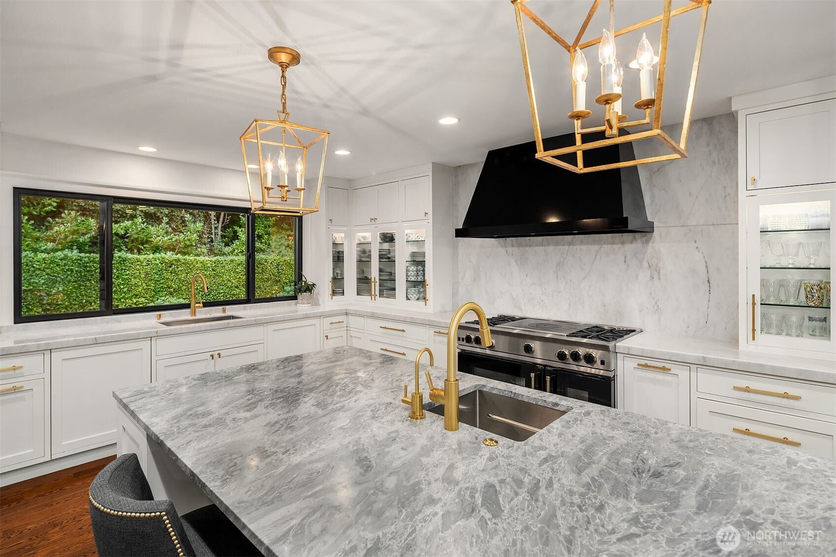 1601 Evergreen Point Road Medina, WA 98039 - Photo 12 of 40 a kitchen with stainless steel appliances granite countertop a stove and a wooden floors