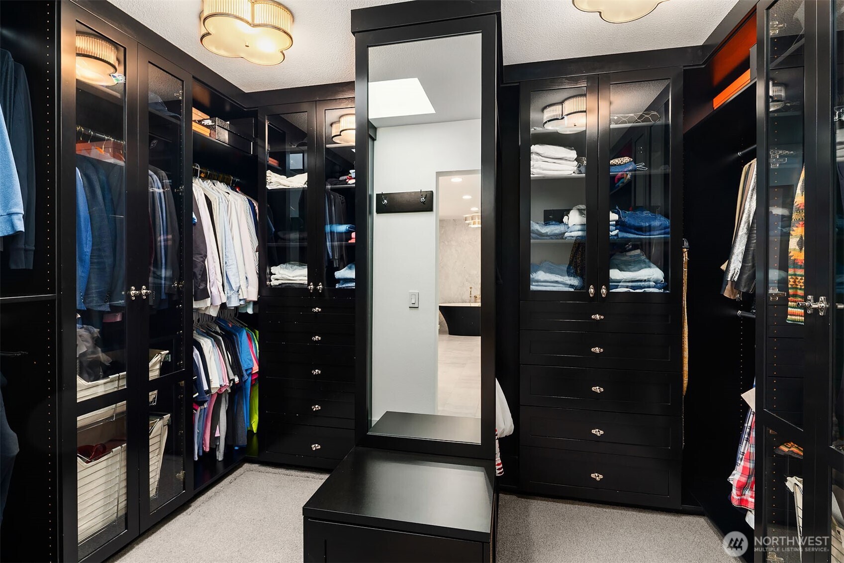 1601 Evergreen Point Road Medina, WA 98039 - Photo 22 of 40 a view of walk in closet with clothes and shoes