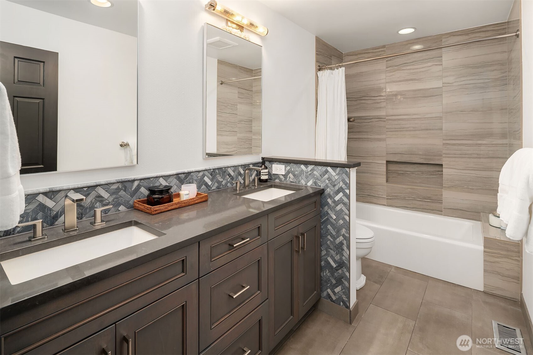 1601 Evergreen Point Road Medina, WA 98039 - Photo 26 of 40 a bathroom with a sink and a bathtub