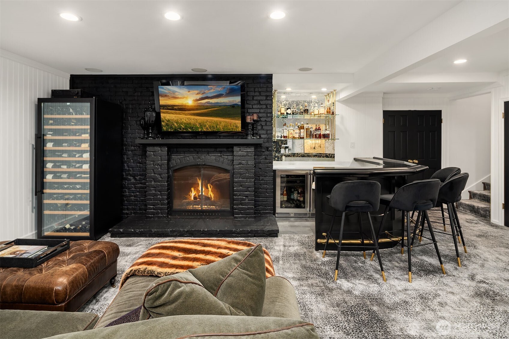 1601 Evergreen Point Road Medina, WA 98039 - Photo 30 of 40 a living room with furniture and a flat screen tv