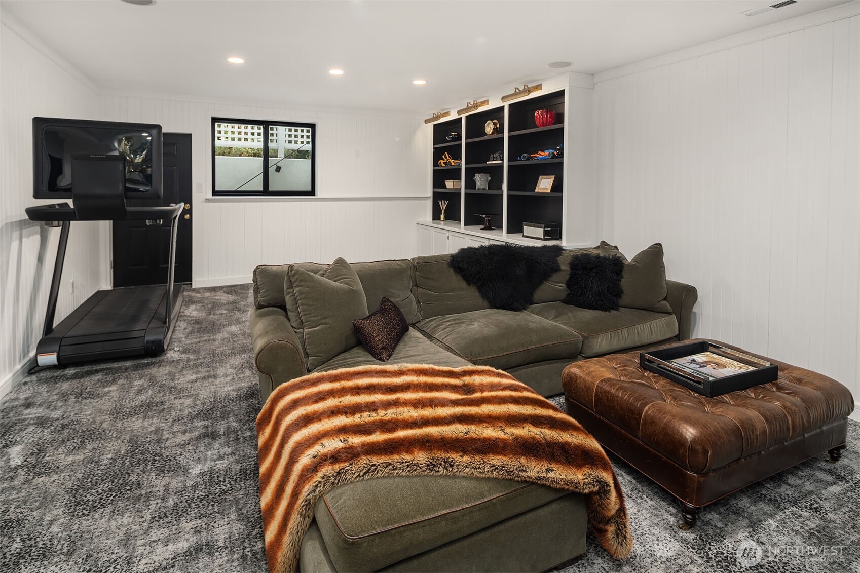 1601 Evergreen Point Road Medina, WA 98039 - Photo 31 of 40 a bedroom with furniture and a flat screen tv