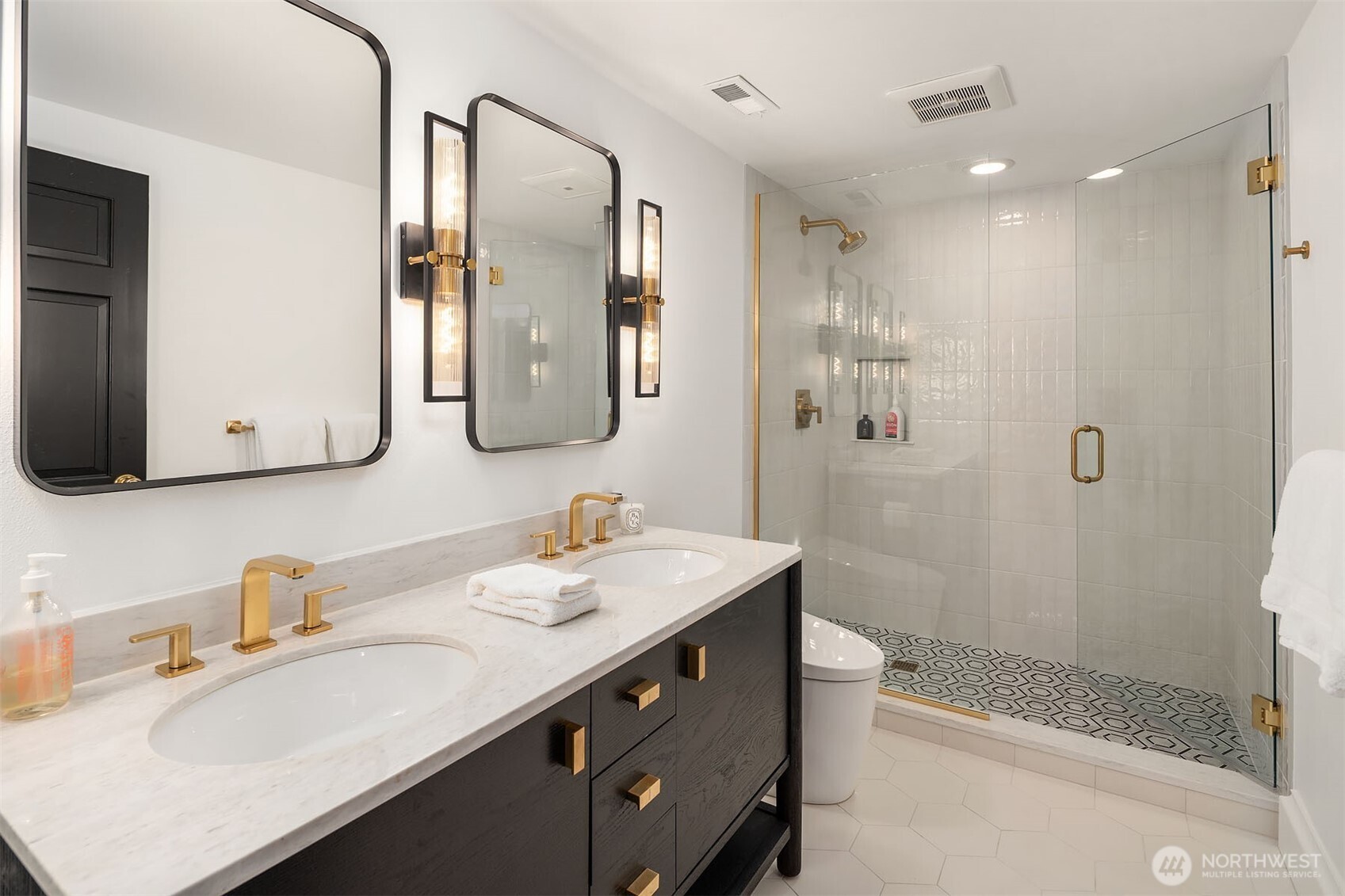 1601 Evergreen Point Road Medina, WA 98039 - Photo 33 of 40 a bathroom with a sink a toilet and shower