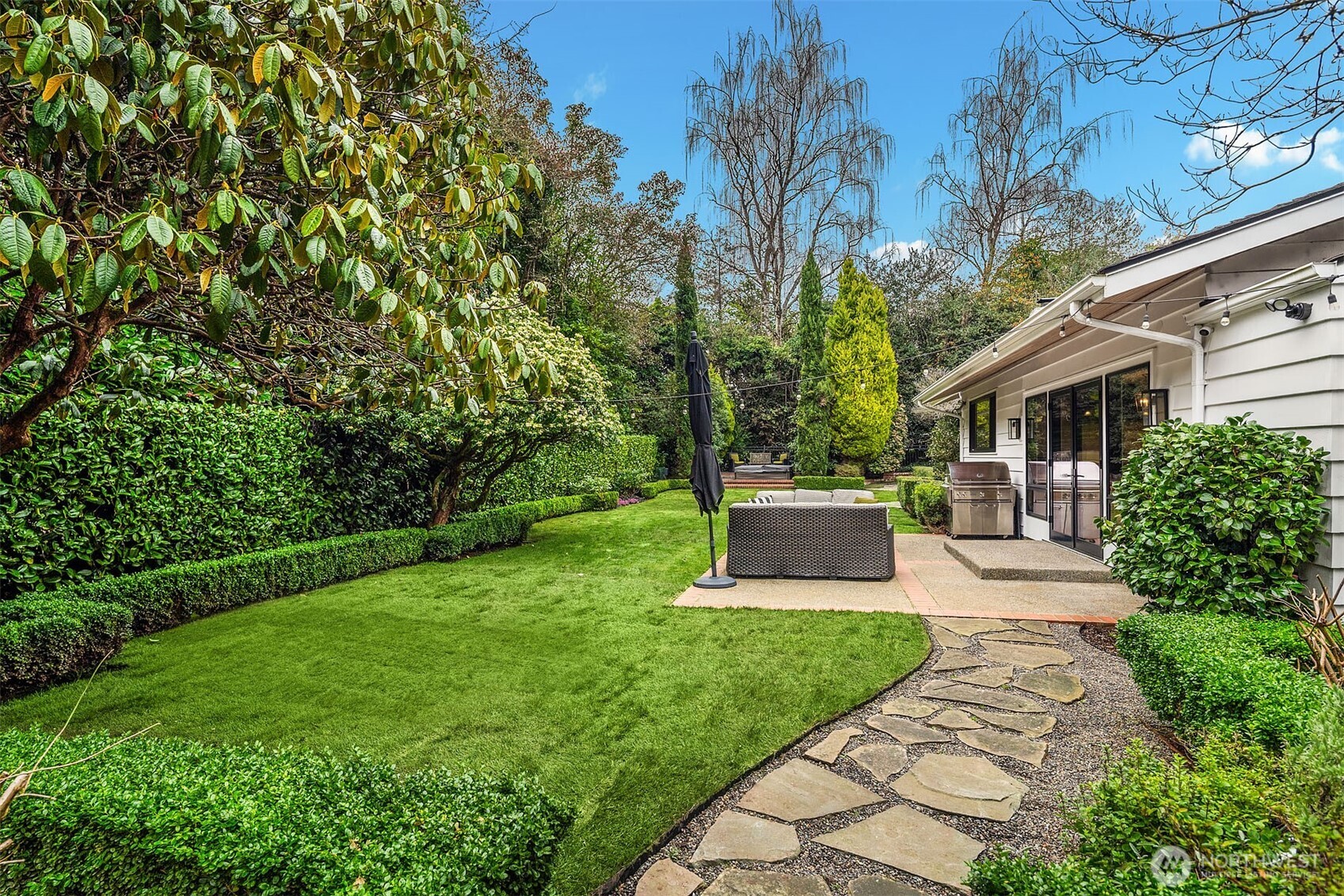 1601 Evergreen Point Road Medina, WA 98039 - Photo 34 of 40 a view of a patio with table and chairs plants and large tree