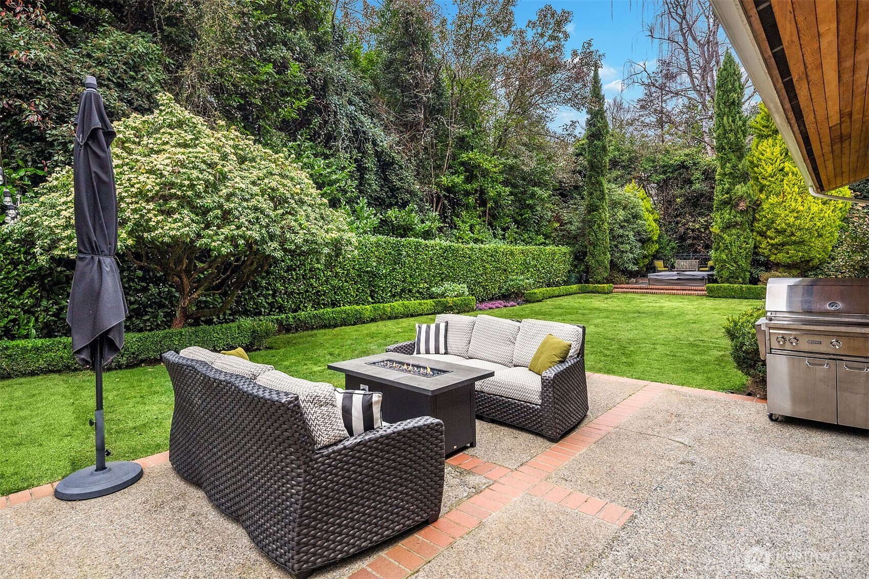 1601 Evergreen Point Road Medina, WA 98039 - Photo 37 of 40 a view of a patio with a yard table and chairs