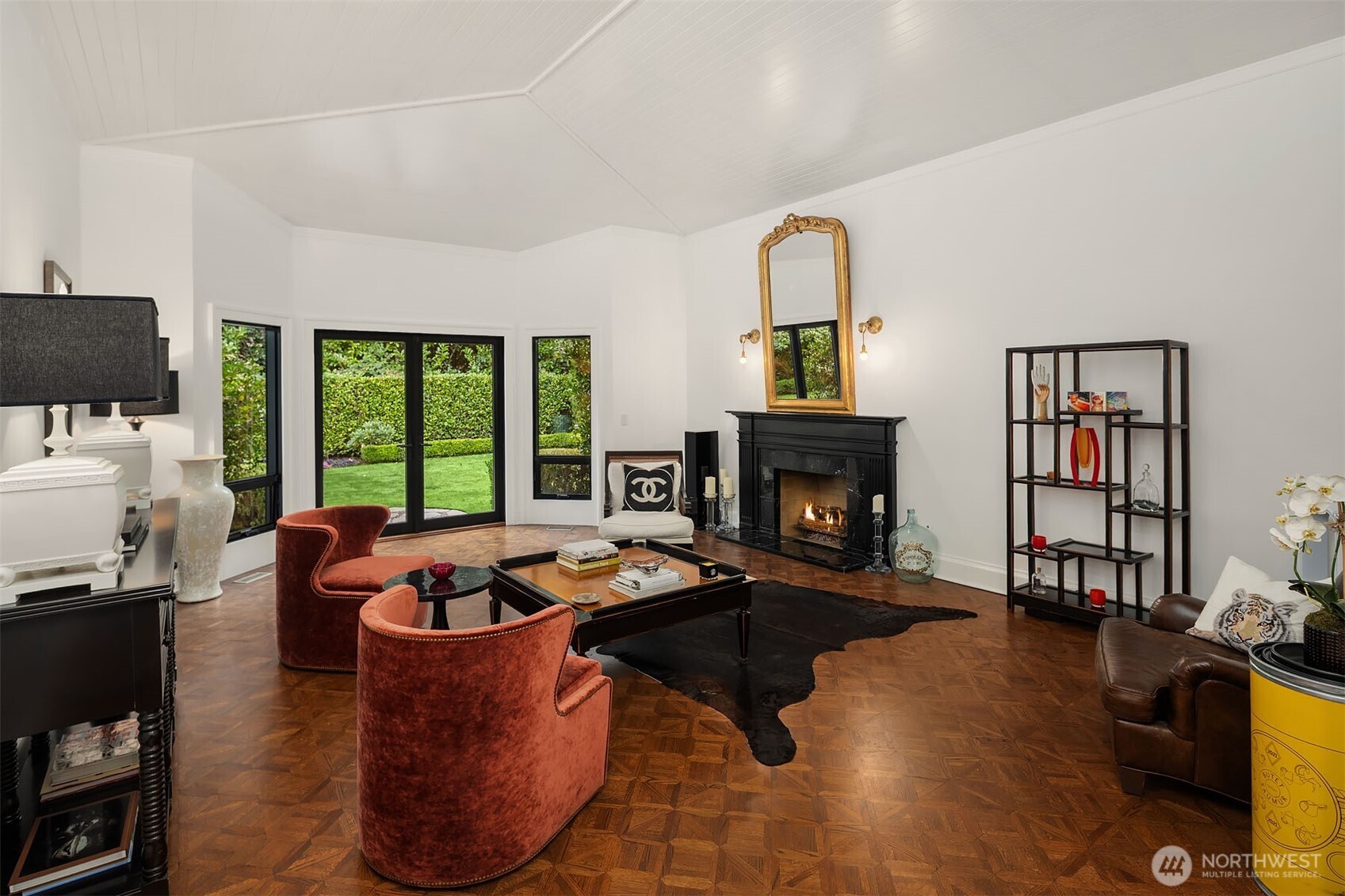 1601 Evergreen Point Road Medina, WA 98039 - Photo 6 of 40 a living room with fireplace furniture and a floor to ceiling window