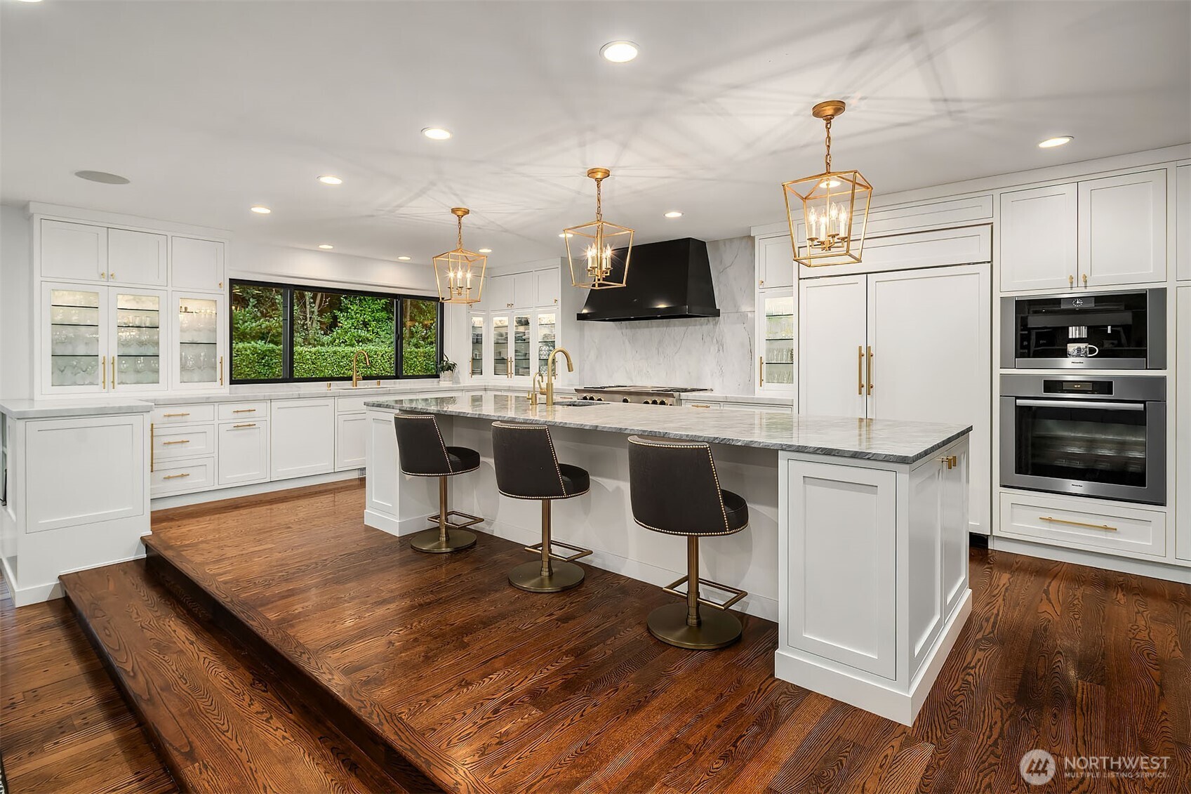 1601 Evergreen Point Road Medina, WA 98039 - Photo 10 of 40 a kitchen with kitchen island a stove a refrigerator and a sink