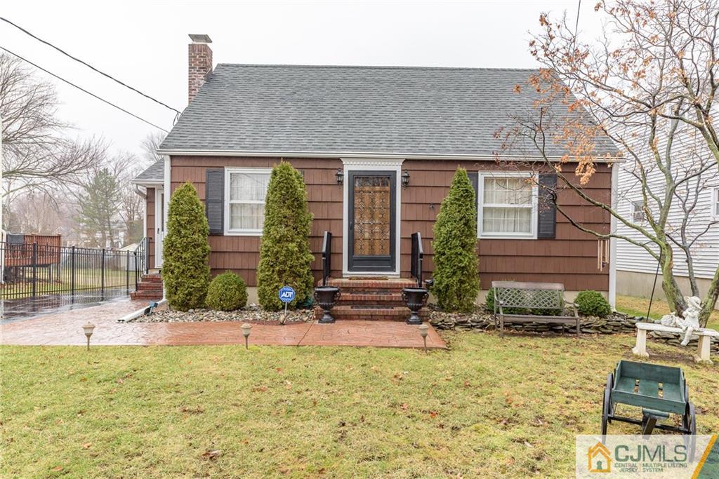 26 Middlesex Road Matawan, NJ 07747 - Photo 1 of 23 a front view of a house with garden