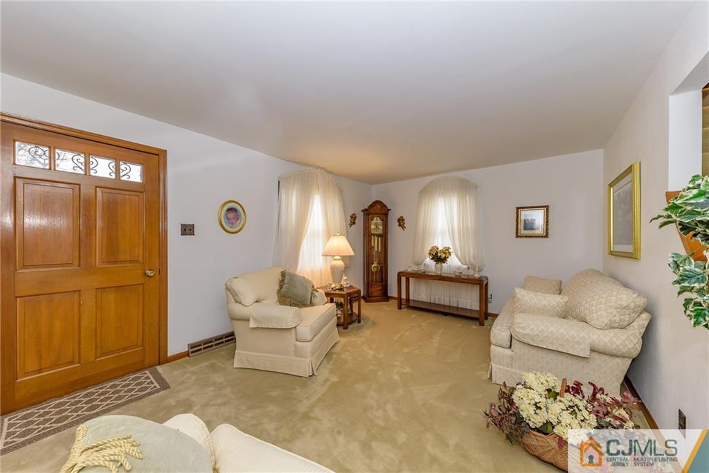26 Middlesex Road Matawan, NJ 07747 - Photo 3 of 23 a living room with furniture and a window