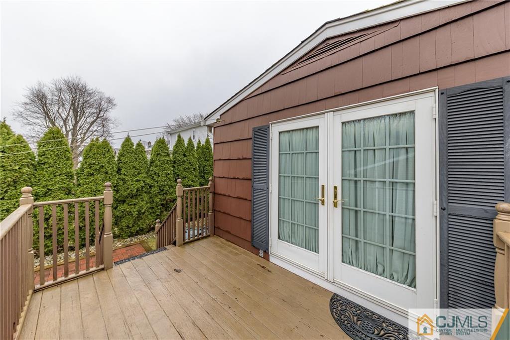 26 Middlesex Road Matawan, NJ 07747 - Photo 22 of 23 a house with wooden floor in front of it