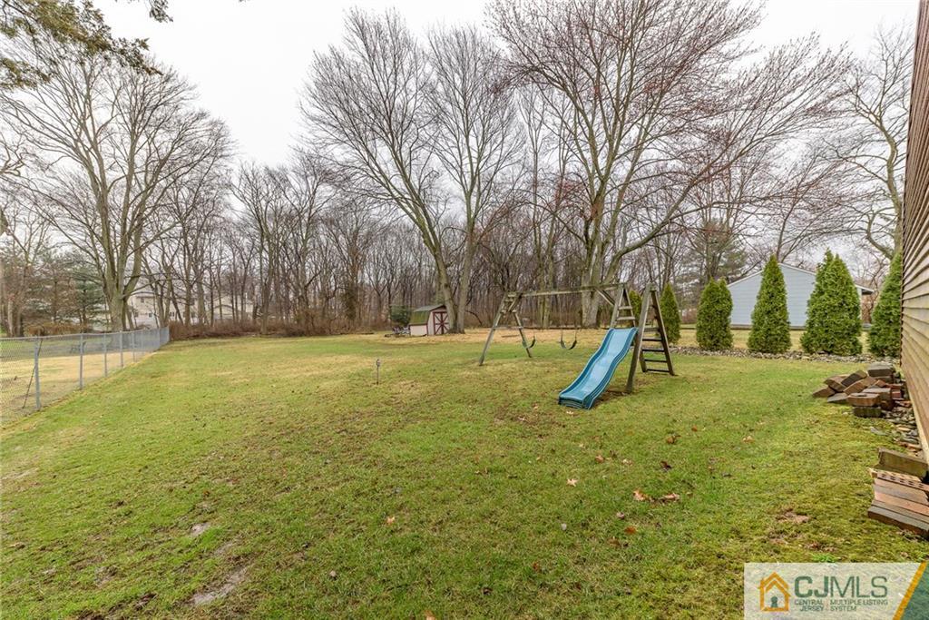 26 Middlesex Road Matawan, NJ 07747 - Photo 23 of 23 a view of a park with swings