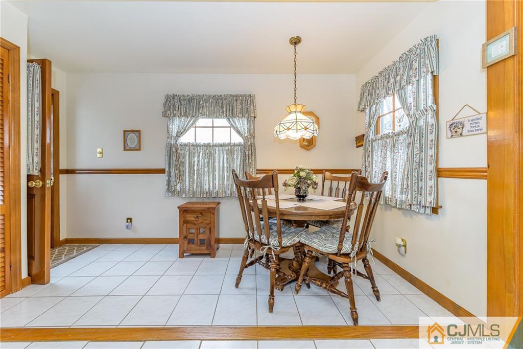 26 Middlesex Road Matawan, NJ 07747 - Photo 8 of 23 a view of a dining room with furniture and chandelier