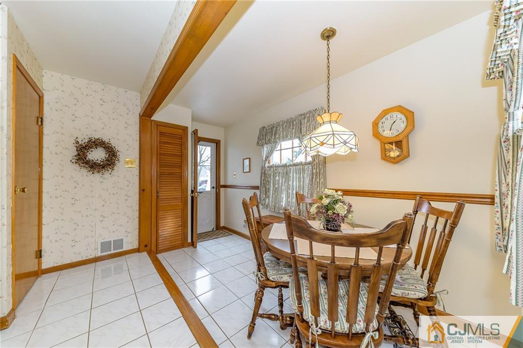 26 Middlesex Road Matawan, NJ 07747 - Photo 9 of 23 a view of a dining room with furniture and chandelier