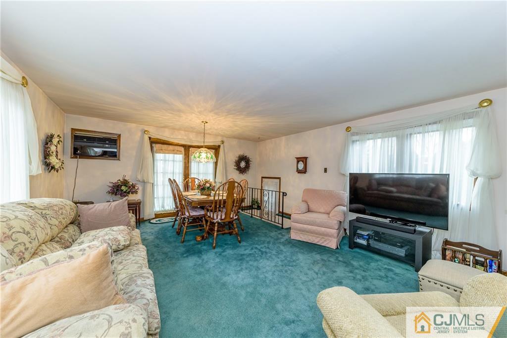 26 Middlesex Road Matawan, NJ 07747 - Photo 10 of 23 a living room with furniture and a flat screen tv