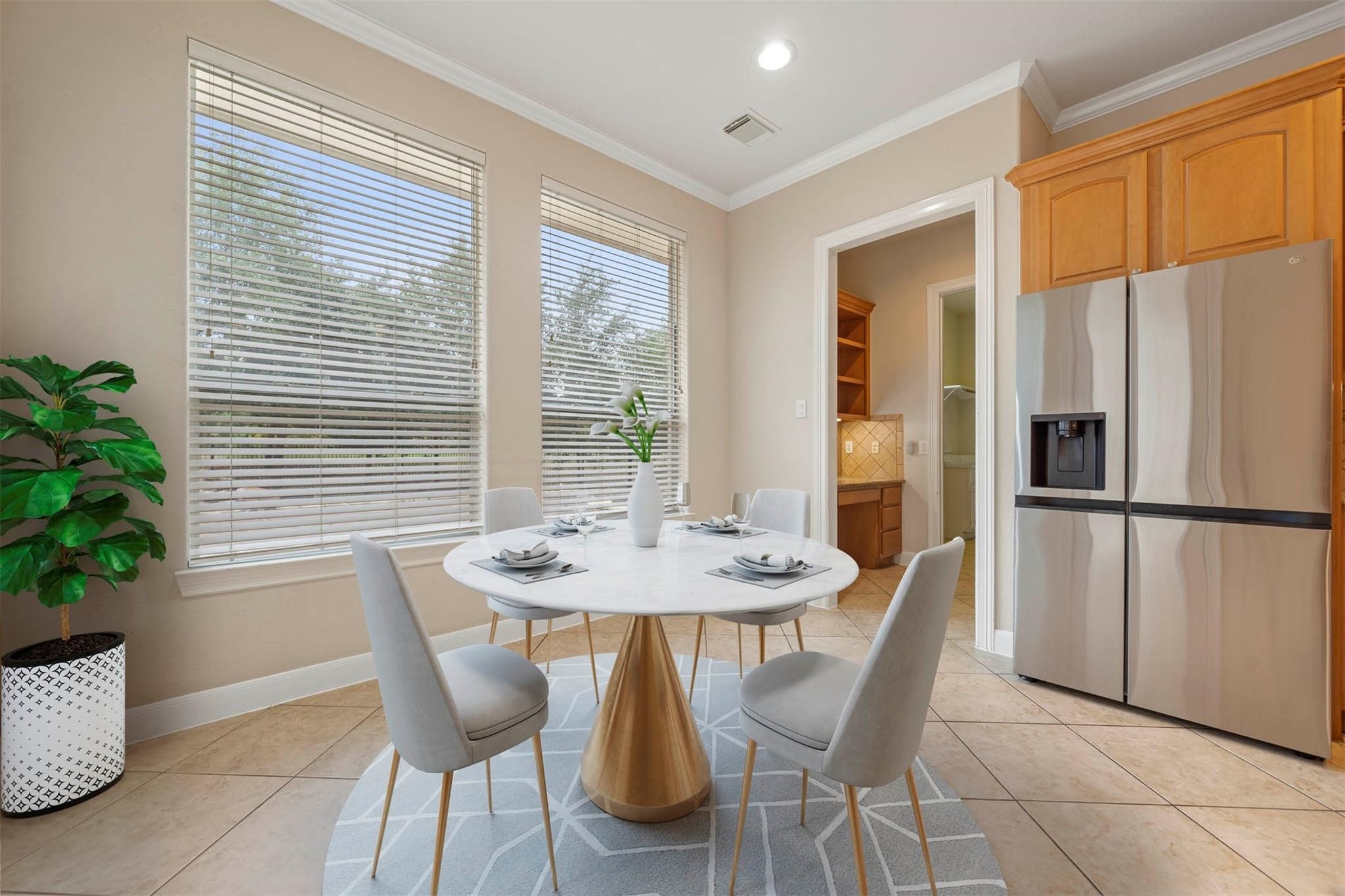 3 Etude Court Spring, TX 77382 - Photo 11 of 45 a view of a dining room with furniture window and wooden floor