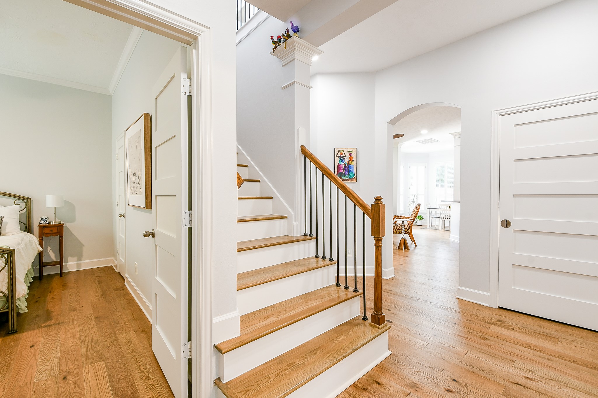 2442 Chimney Rock Road Houston, TX 77057 - Photo 25 of 50 a view of a hallway view with wooden floor and staircase