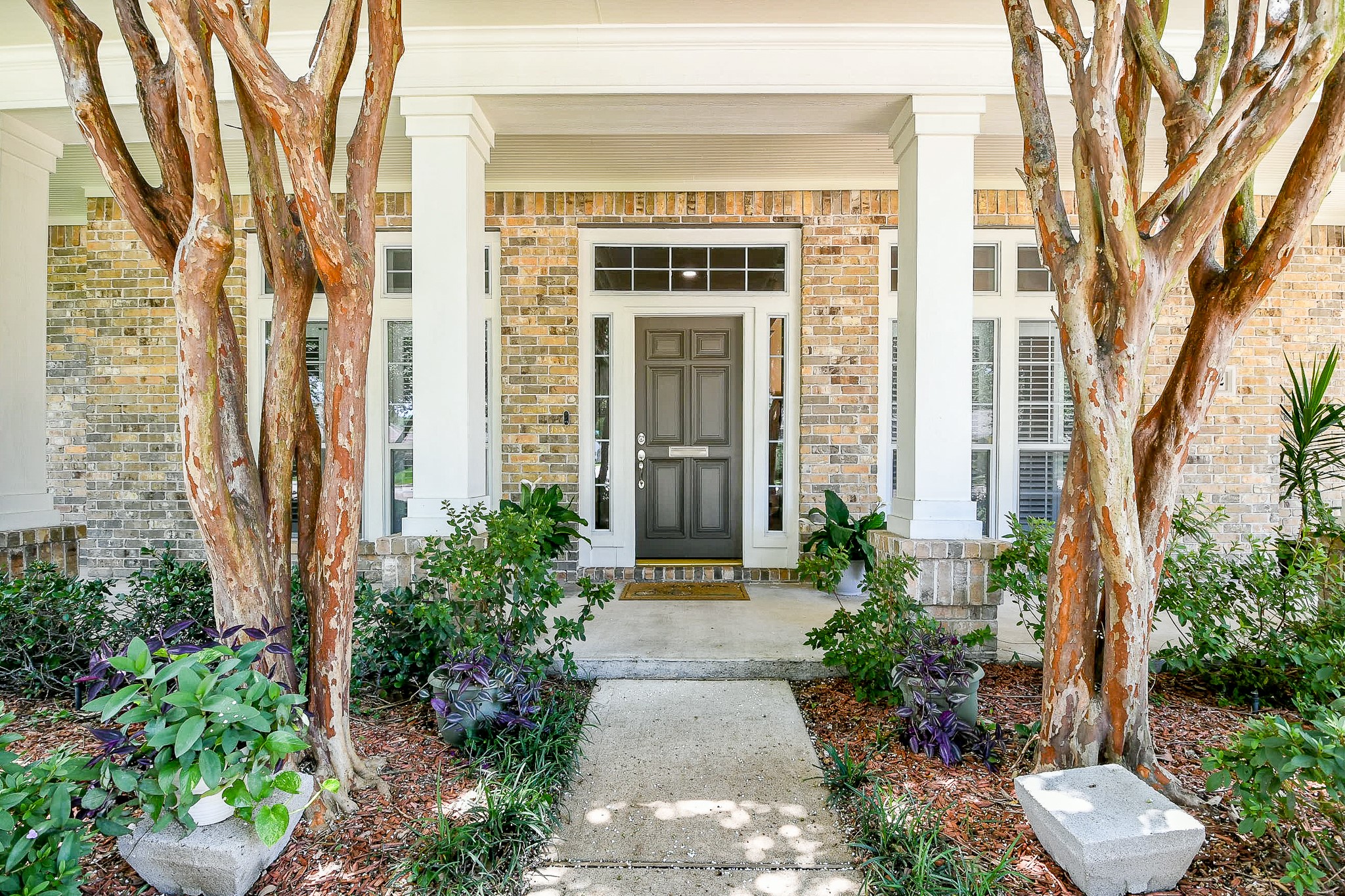 2442 Chimney Rock Road Houston, TX 77057 - Photo 4 of 50 front view of a house with a yard