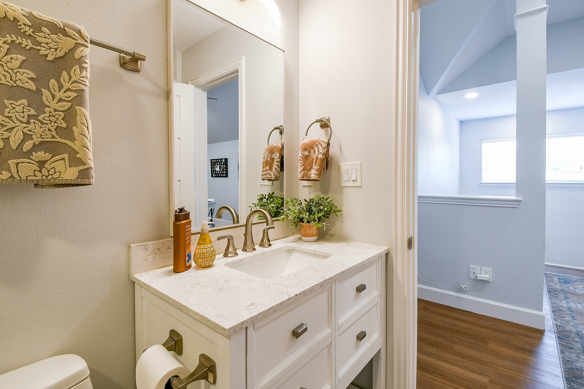 2442 Chimney Rock Road Houston, TX 77057 - Photo 45 of 50 a bathroom with a sink vanity and a mirror