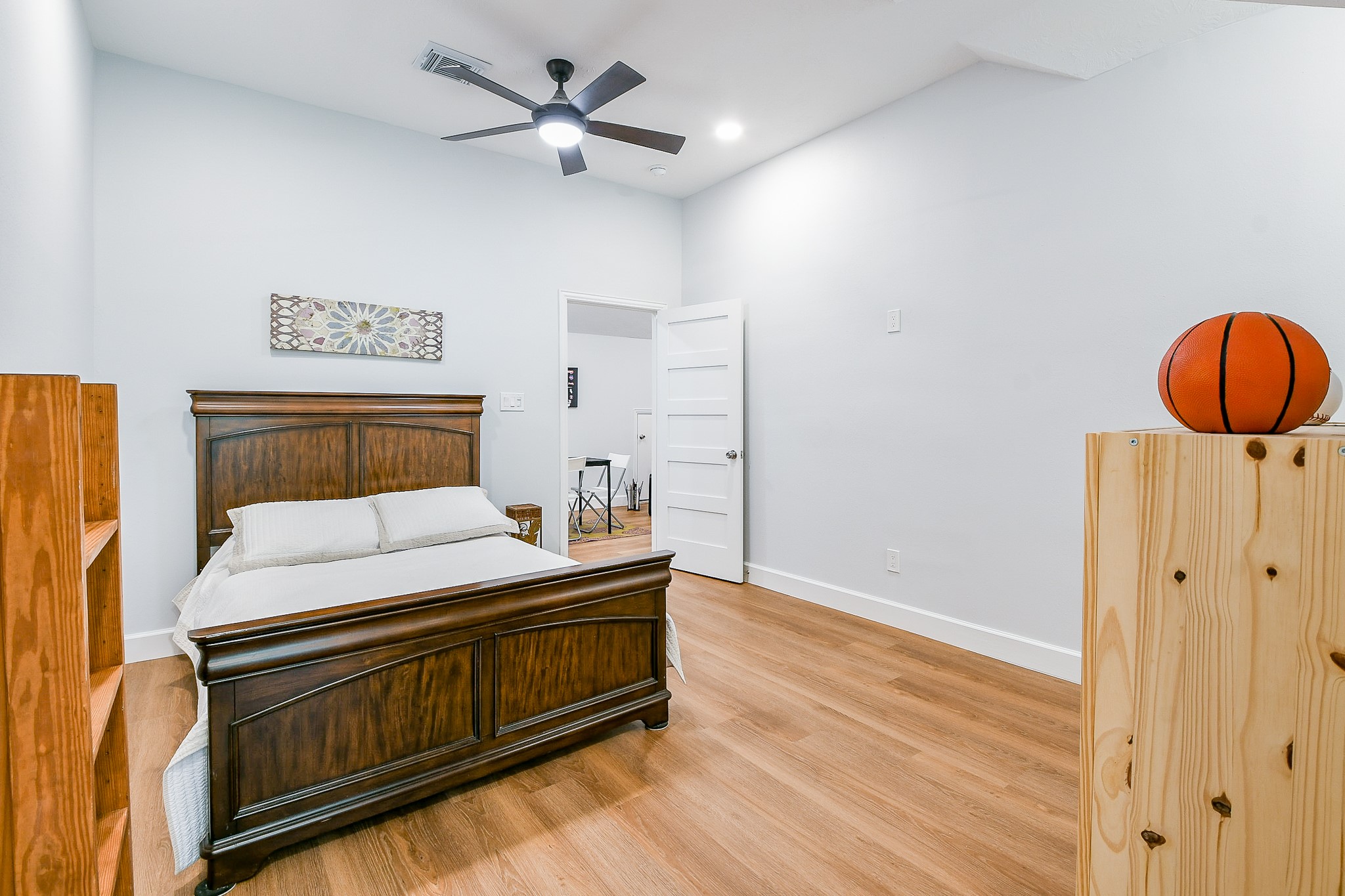 2442 Chimney Rock Road Houston, TX 77057 - Photo 47 of 50 a bedroom with a bed and a chandelier