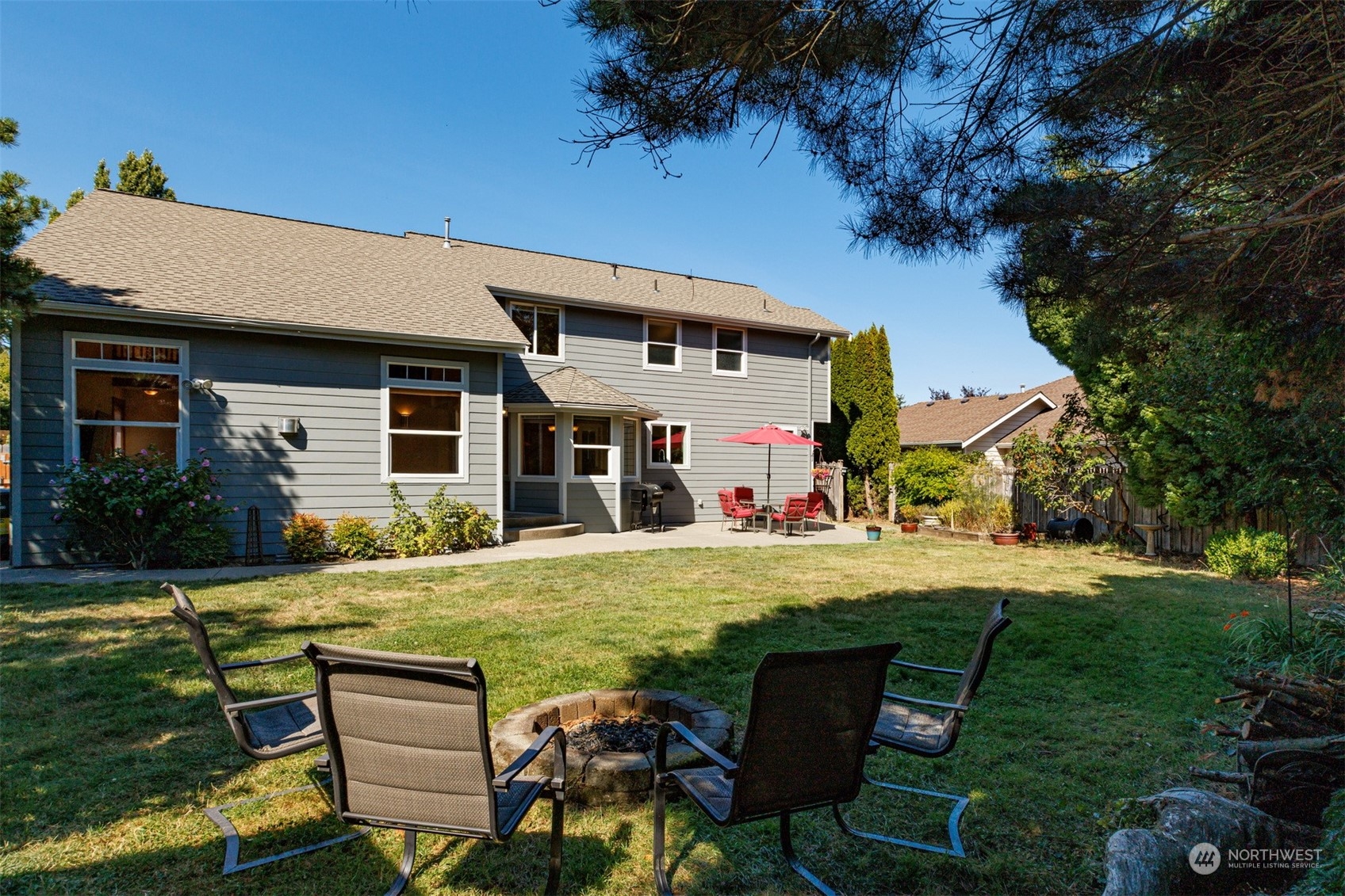 1311 Roma Road Bellingham, WA 98226 - Photo 32 of 38 a view of a house with backyard porch and sitting area